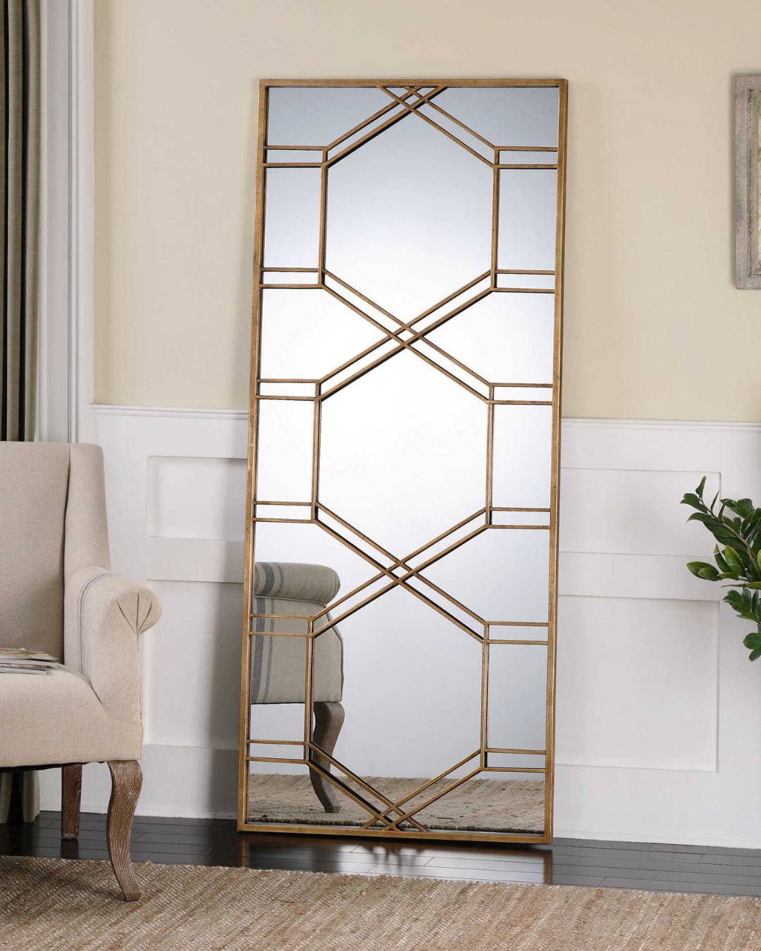 gold mirror on the side of the living room